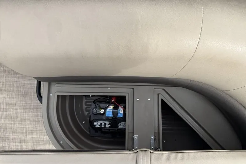 Slide: The Image of 2024 Sun Tracker Party Barge 16 DLX battery compartment under seat. - 17
