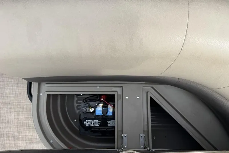 Slide: The Image of 2024 Sun Tracker Party Barge 16 DLX battery compartment with seating. - 19