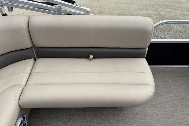 Slide: The Image of 2024 Sun Tracker Party Barge 16 DLX beige seating with gray accents on a pontoon boat. - 20
