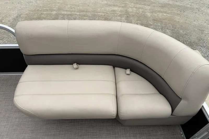 Slide: The Image of 2024 Sun Tracker Party Barge 16 DLX beige and gray seating on pontoon boat. - 6