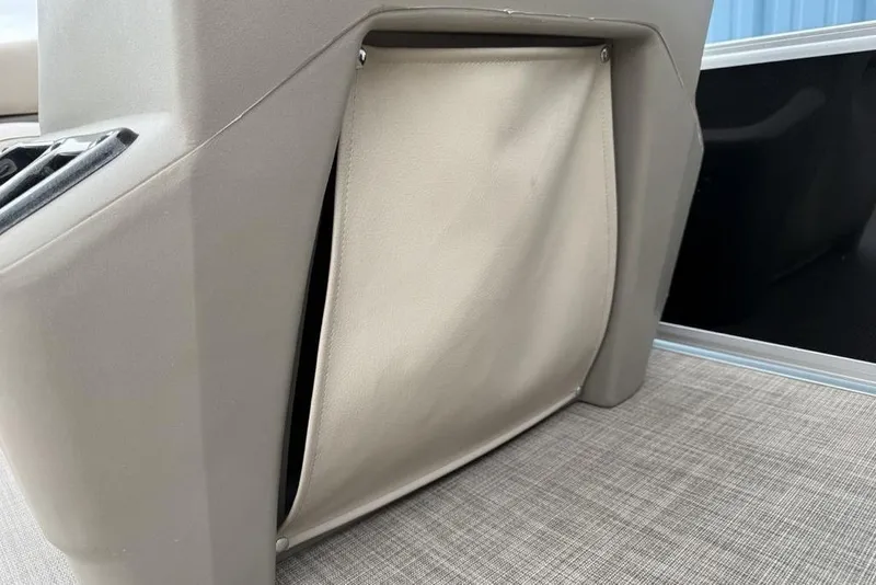 Slide: The Image of 2024 Sun Tracker Party Barge 16 DLX interior storage compartment detail. - 8