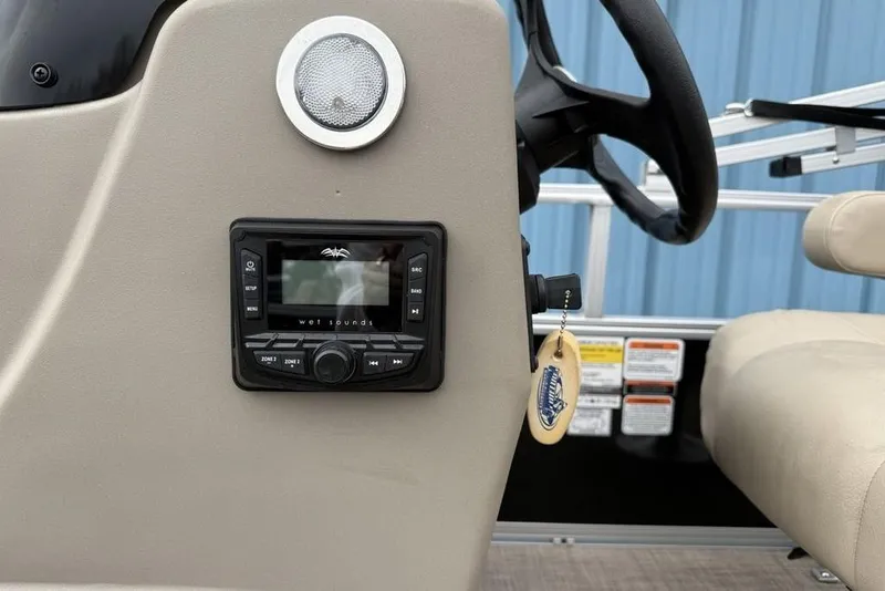 Slide: The Image of 2024 Sun Tracker Party Barge 16 DLX dashboard with Wet Sounds audio system. - 9
