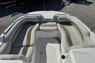 Slide: The Image of 2012 NauticStar 210DC Sport Deck boat interior with cushioned seating and sleek design. - 4
