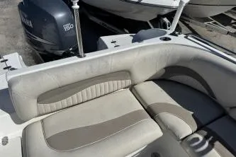 Slide: The Image of 2012 NauticStar 210DC Sport Deck boat with Yamaha 150 engine, featuring comfortable seating. - 7