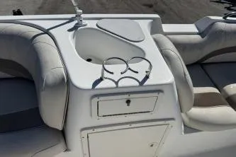 Slide: The Image of 2012 NauticStar 210DC Sport Deck boat interior with seating and storage. - 8