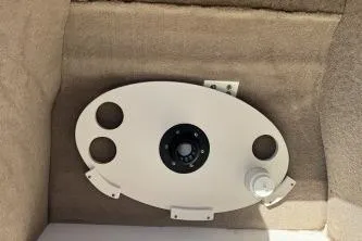 Slide: The Image of 2012 NauticStar 210DC Sport Deck boat table with cup holders and mount. - 9