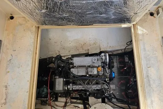 Slide: The Image of Engine compartment of 2002 Parker Marine Enterprises Lorcha 50 boat, showing detailed machinery. - 11