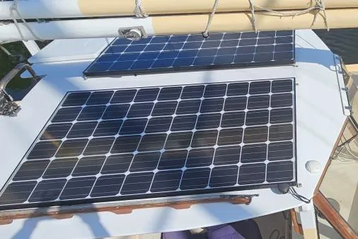 Slide: The Image of Solar panels on 2002 Parker Marine Enterprises Lorcha 50 sailboat deck. - 13