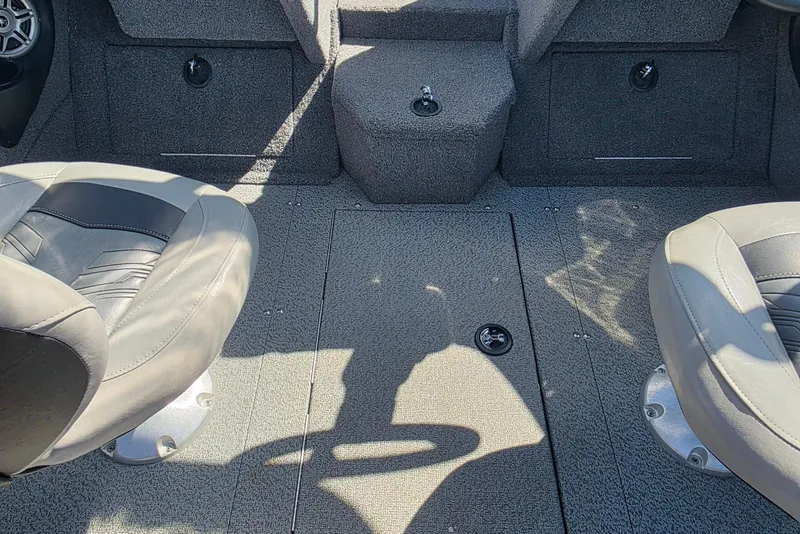Slide: The Image of 2019 Tracker Targa V-18 WT boat interior with two seats and carpeted flooring. - 10