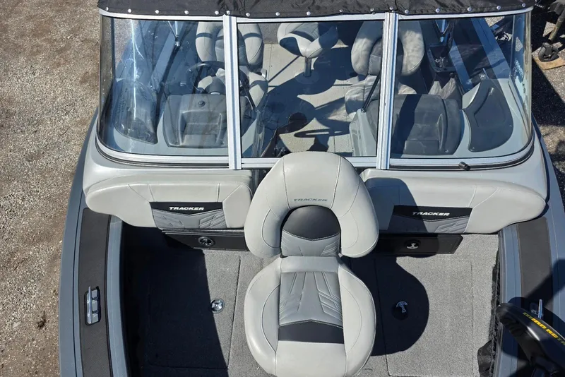 Slide: The Image of 2019 Tracker Targa V-18 WT boat interior with seating and windshield. - 19