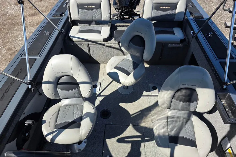 Slide: The Image of 2019 Tracker Targa V-18 WT boat interior with four gray seats. - 21