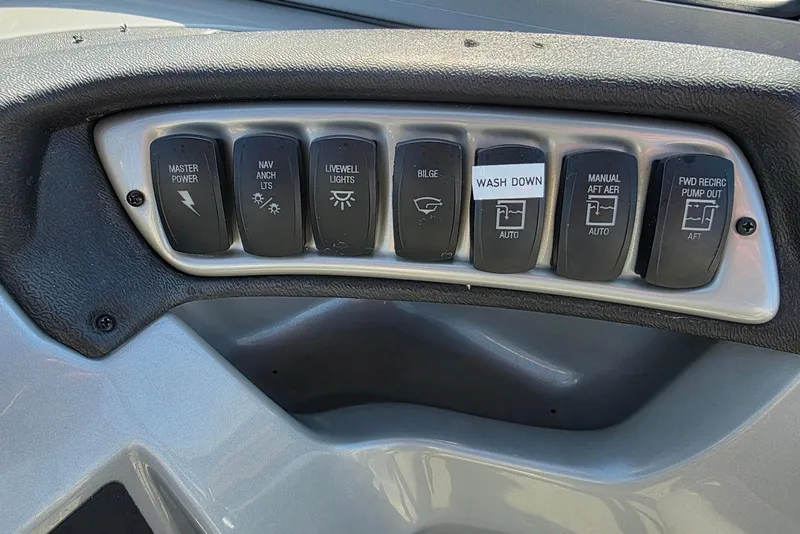 Slide: The Image of Control panel of a 2019 Tracker Targa V-18 WT boat with labeled switches. - 23