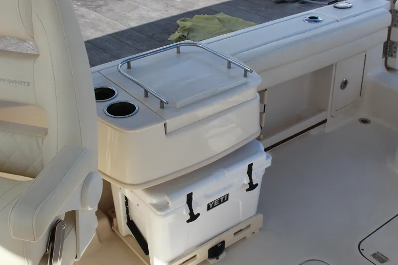 Slide: The Image of 2023 Grady-White Freedom 235 boat interior with seating and stainless steel fixtures. - 22