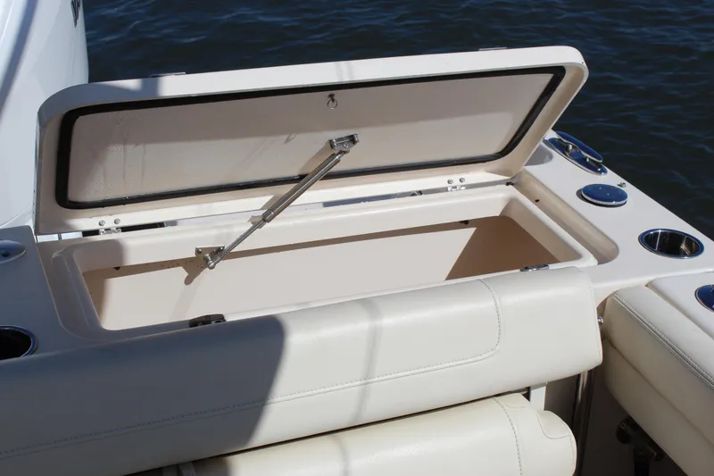 Slide: The Image of Open storage compartment on 2023 Grady-White Freedom 235 boat deck. - 25