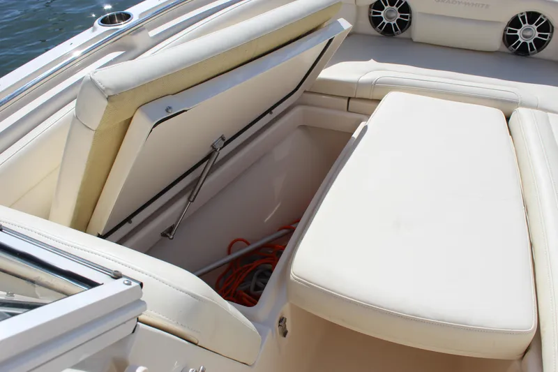 Slide: The Image of 2023 Grady-White Freedom 235 boat interior with Garmin navigation system and steering wheel. - 30