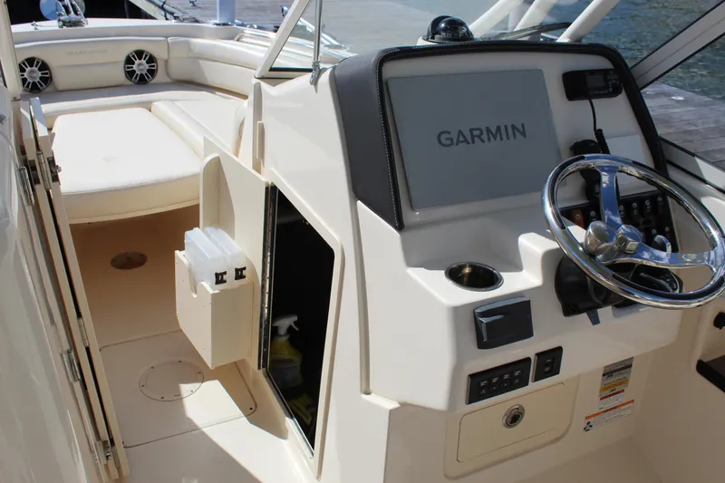 Slide: The Image of 2023 Grady-White Freedom 235 boat interior with cabin and helm features. - 31