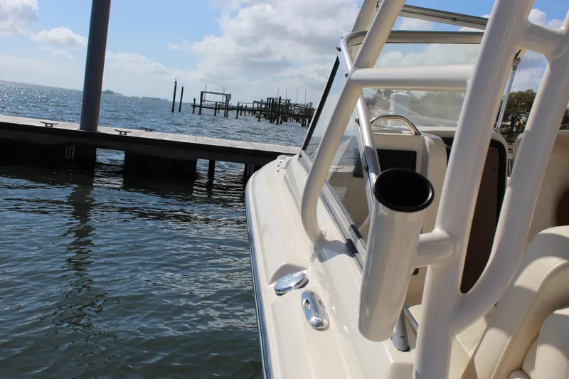 Slide: The Image of 2023 Grady-White Freedom 235 boat top view with rod holders and clear sky. - 33