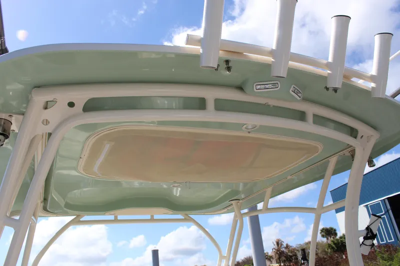 Slide: The Image of 2023 Grady-White Freedom 235 boat detail with ocean view and dock in background. - 34