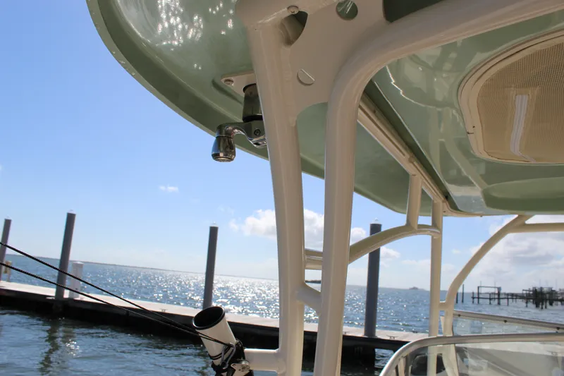 Slide: The Image of 2023 Grady-White Freedom 235 boat deck with engine and storage compartment. - 35