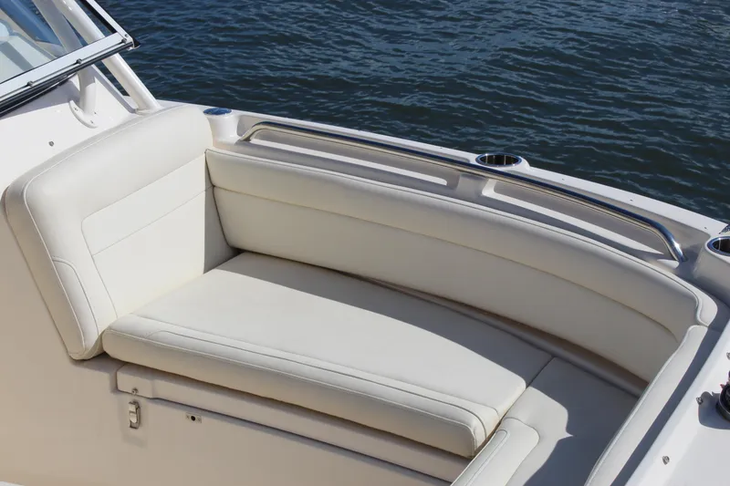 Slide: The Image of 2023 Grady-White Freedom 235 boat interior with anchor and seating, on water. - 5