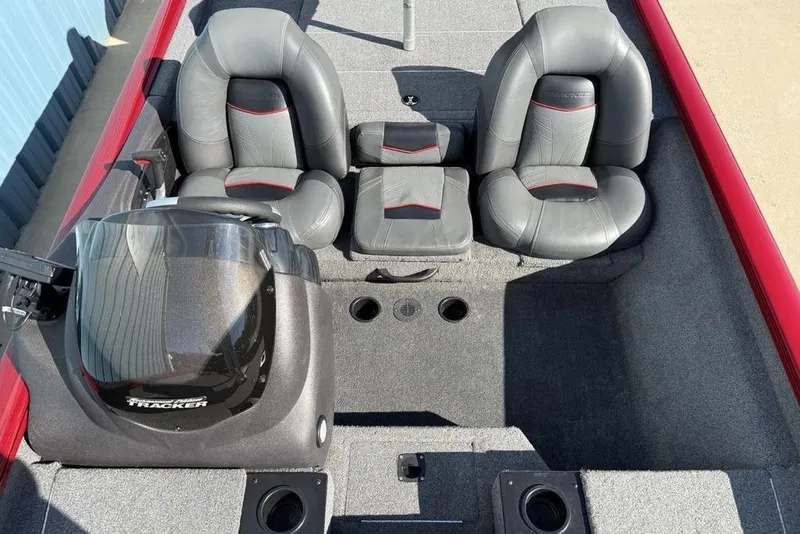 Slide: The Image of 2022 Tracker Pro Team 175 TXW Tournament Edition boat interior with gray seating and console. - 12