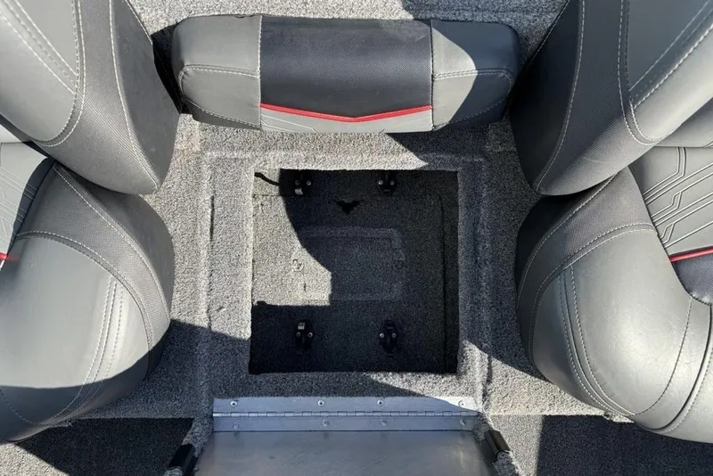 Slide: The Image of 2022 Tracker Pro Team 175 TXW Tournament Edition boat interior with gray seating and storage compartment. - 16