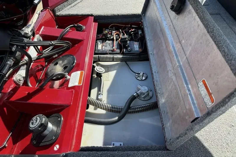 Slide: The Image of 2022 Tracker Pro Team 175 TXW Tournament Edition boat interior showing engine components and wiring. - 22