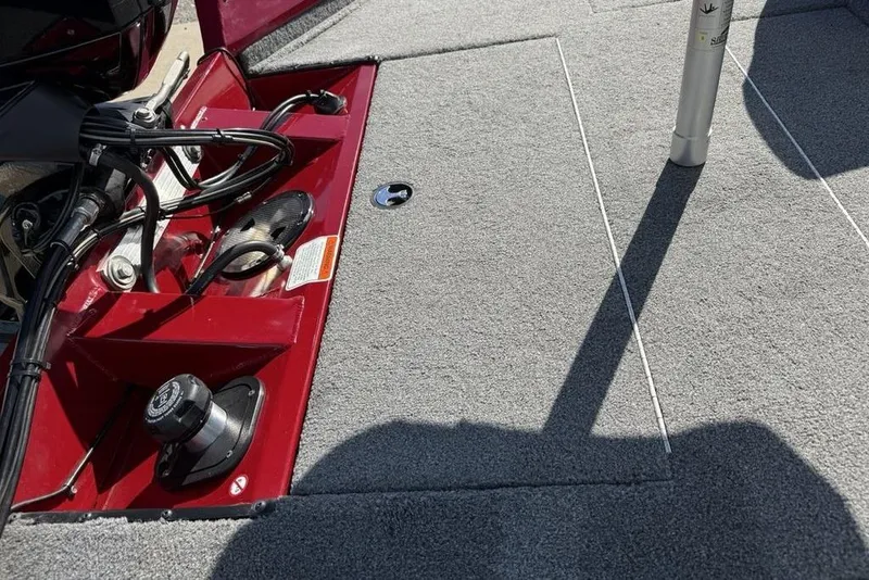 Slide: The Image of 2022 Tracker Pro Team 175 TXW Tournament Edition boat interior with red accents and gray carpet. - 23