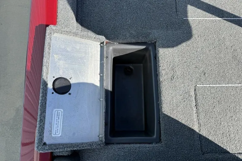 Slide: The Image of Open storage compartment on 2022 Tracker Pro Team 175 TXW Tournament Edition boat. - 27