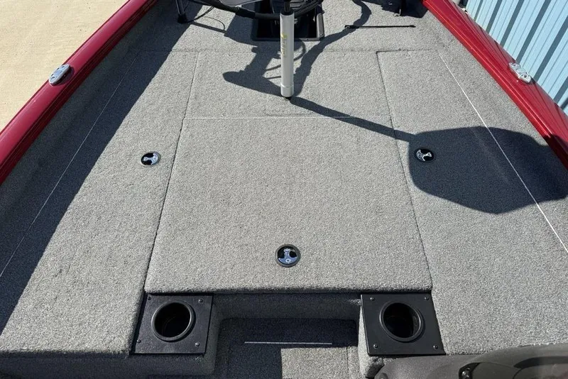 Slide: The Image of 2022 Tracker Pro Team 175 TXW Tournament Edition boat deck with gray carpet and storage compartments. - 8