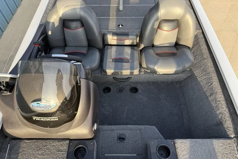Slide: The Image of 2022 Tracker Pro Team 175 TXW boat interior with seating and console. - 11