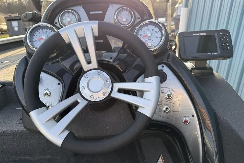 Slide: The Image of Steering console of 2022 Tracker Pro Team 175 TXW boat with gauges and Lowrance display. - 12