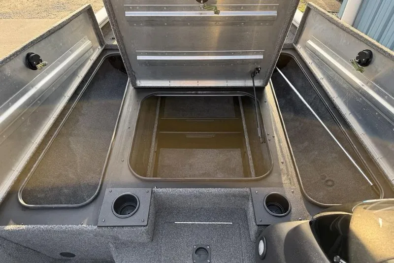 Slide: The Image of 2022 Tracker Pro Team 175 TXW boat storage compartments open, showcasing interior space. - 14