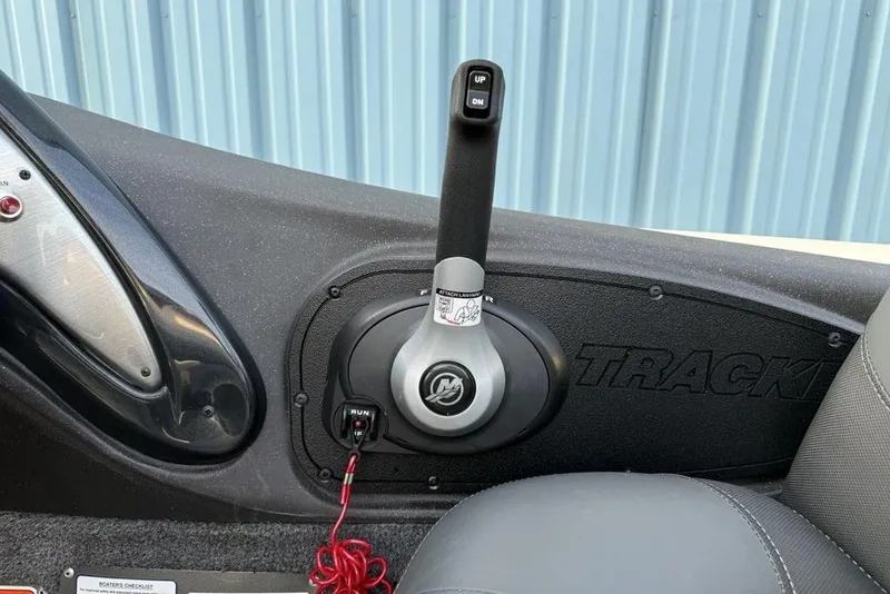 Slide: The Image of 2022 Tracker Pro Team 175 TXW boat throttle control with "UP" and "DN" buttons. - 16