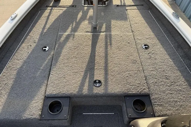 Slide: The Image of 2022 Tracker Pro Team 175 TXW boat deck with carpeted surface and storage compartments. - 8