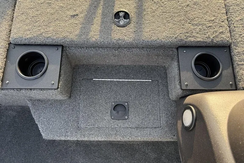 Slide: The Image of 2022 Tracker Pro Team 175 TXW boat interior with cup holders and storage compartment. - 10