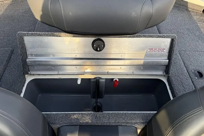 Slide: The Image of 2022 Tracker Pro Team 175 TXW boat storage compartment with pump-out feature. - 21