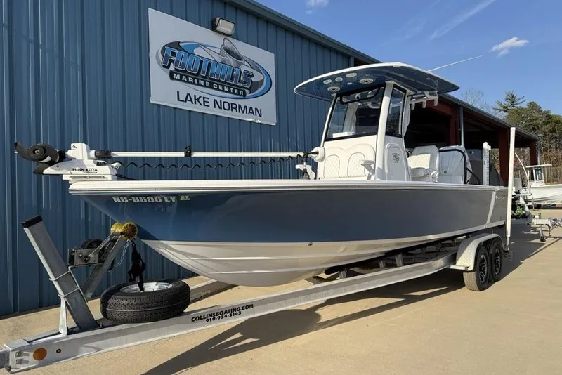 Slide: The Image of 2022 Sportsman Masters 247OE Bay Boat on trailer at Foothills Marine Center. - 1