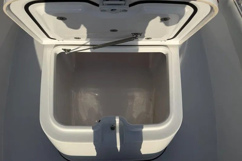 Slide: The Image of Open storage compartment on 2022 Sportsman Masters 247OE Bay Boat. - 12