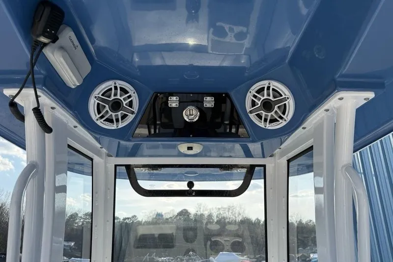 Slide: The Image of 2022 Sportsman Masters 247OE Bay Boat interior with speakers and electronics. - 14