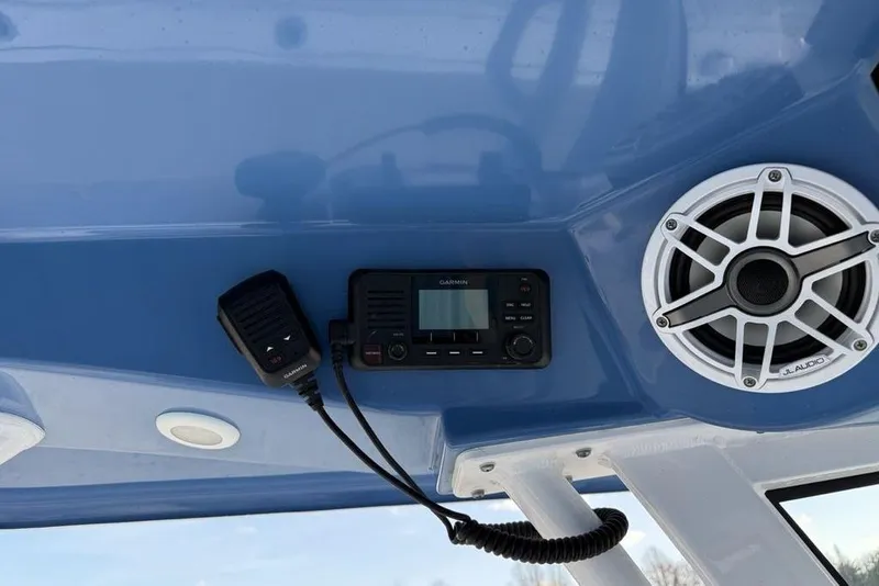 Slide: The Image of 2022 Sportsman Masters 247OE Bay Boat dashboard with Garmin radio and JL Audio speaker. - 15