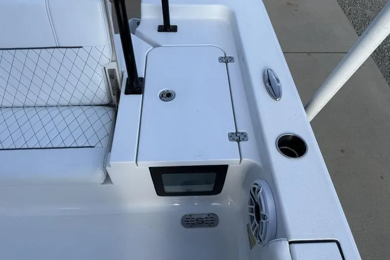 Slide: The Image of 2022 Sportsman Masters 247OE Bay Boat interior with seating and storage compartment. - 18