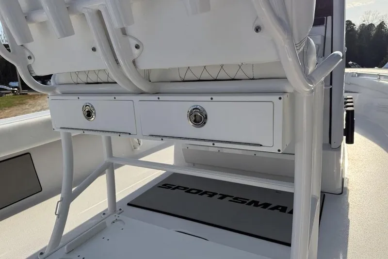Slide: The Image of 2022 Sportsman Masters 247OE Bay Boat interior with storage drawers and seating. - 29
