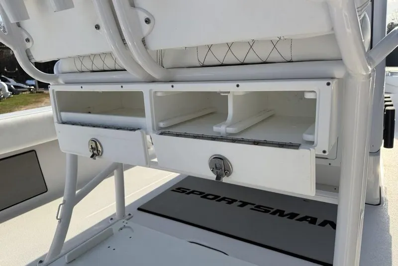Slide: The Image of 2022 Sportsman Masters 247OE Bay Boat storage compartments with secure locks and seating. - 30
