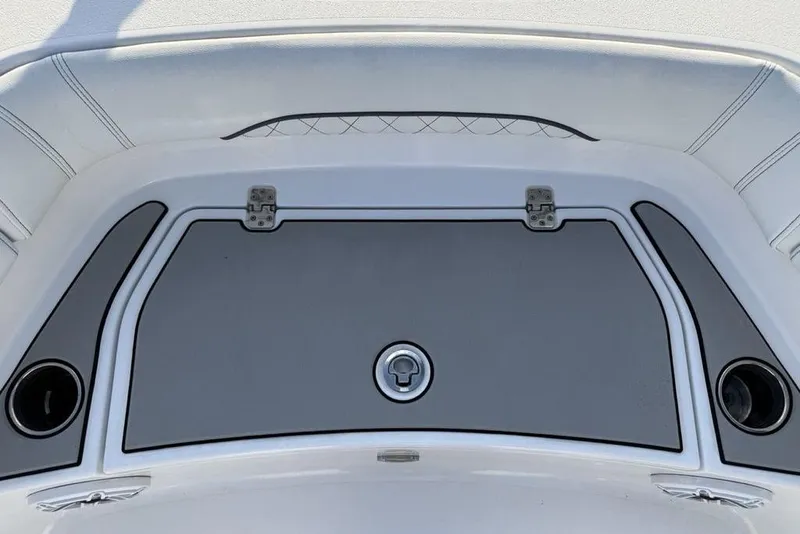 Slide: The Image of 2022 Sportsman Masters 247OE Bay Boat deck with storage compartment and cup holders. - 4