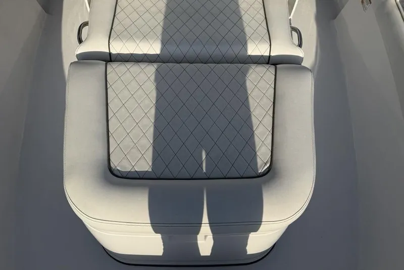 Slide: The Image of 2022 Sportsman Masters 247OE Bay Boat seat with diamond-pattern upholstery. - 9