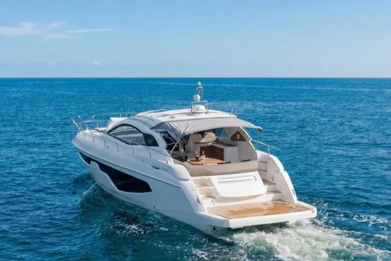Slide: The Image of 2024 Sessa Marine C44 Cruiser yacht navigating on open sea. - 22