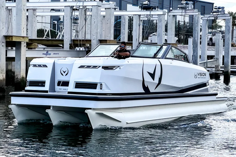 Slide: The Image of 2026 Ingenity EL electric boat cruising near a marina dock. - 24