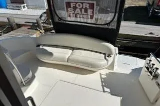 Slide: The Image of Interior of 2007 Meridian 391 Sedan yacht with wood paneling and a small TV. - 10