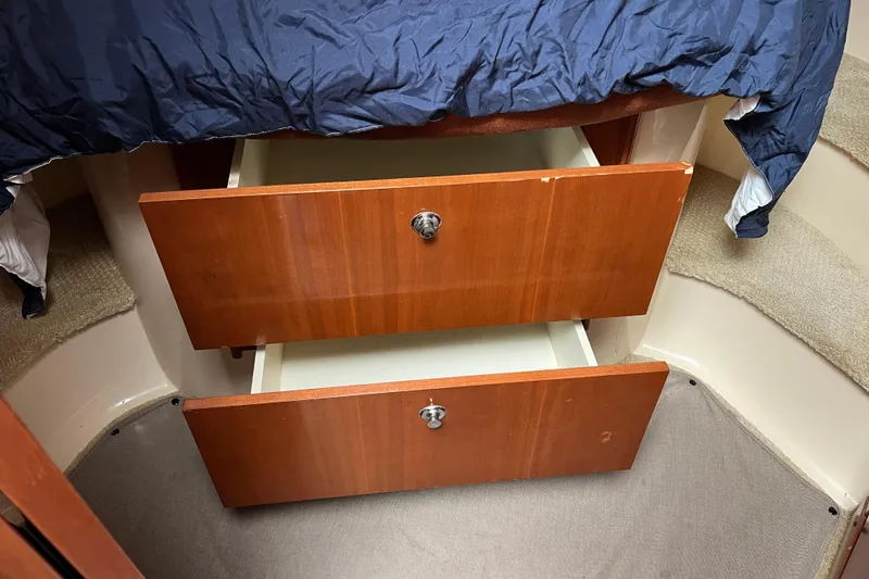 Slide: The Image of Wooden drawers under bed in 2007 Meridian 391 Sedan interior. - 13